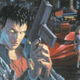 Cover art for the original Cyberpunk roleplaying game shows a man with a gun in the foreground.